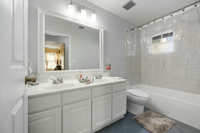 full bathroom featuring shower / bath combo with shower curtain, tile patterned floors, toilet, and vanity