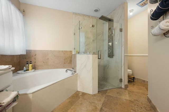 bathroom with shower with separate bathtub and vanity