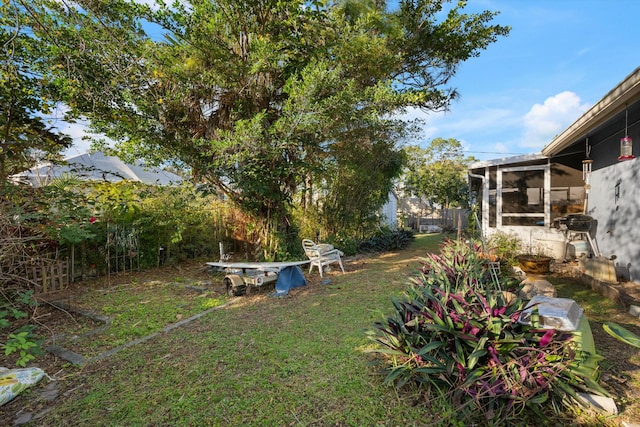 view of yard with a sunroom