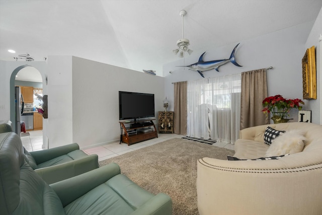 tiled living room with vaulted ceiling and ceiling fan