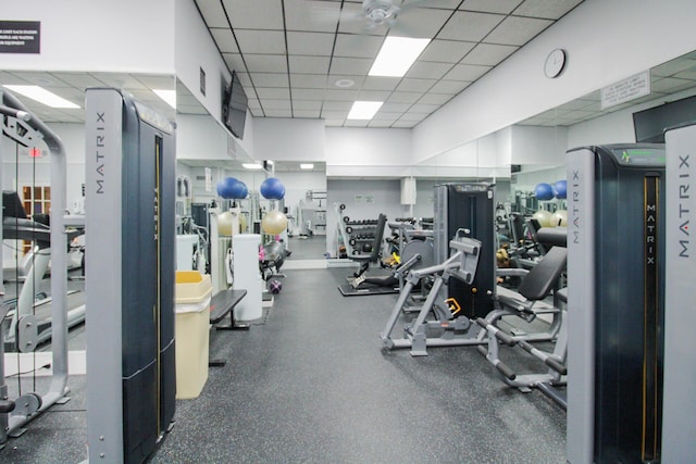 workout area featuring a drop ceiling