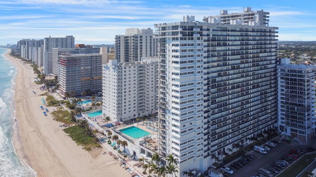 bird's eye view featuring a water view and a view of the beach