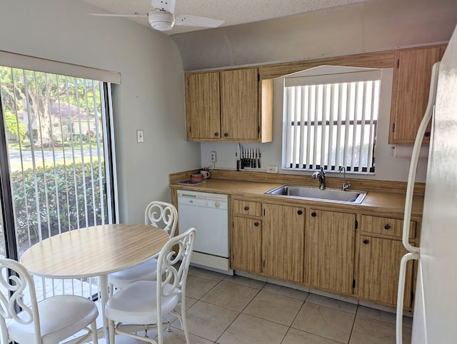 kitchen featuring ceiling fan, sink, wood counters, white appliances, and light tile patterned flooring