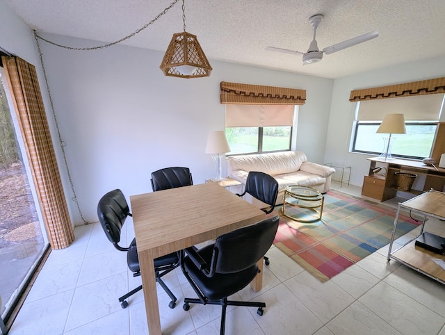 home office featuring a textured ceiling and ceiling fan