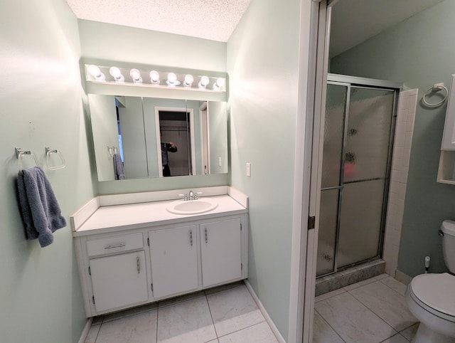 bathroom with tile patterned flooring, a textured ceiling, toilet, vanity, and a shower with shower door