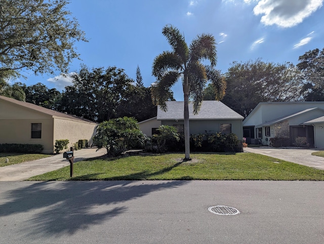 single story home with a front yard