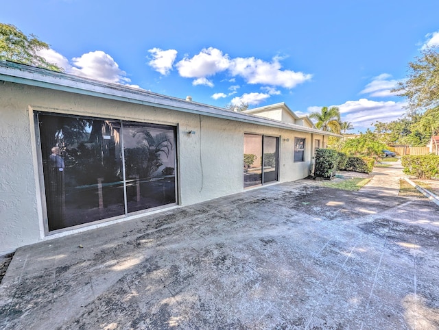 back of property featuring a patio