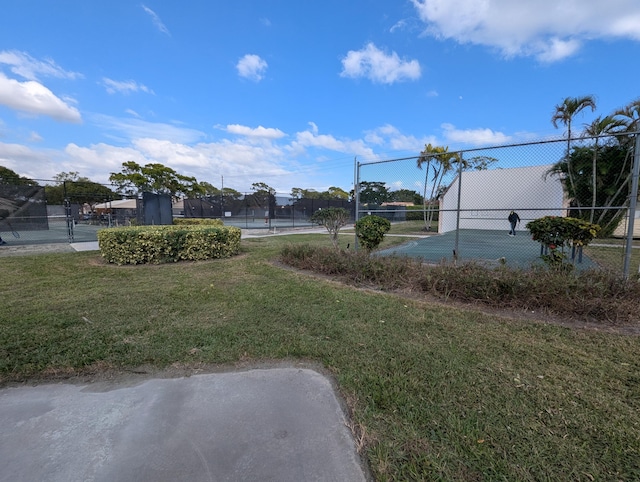 view of yard with tennis court