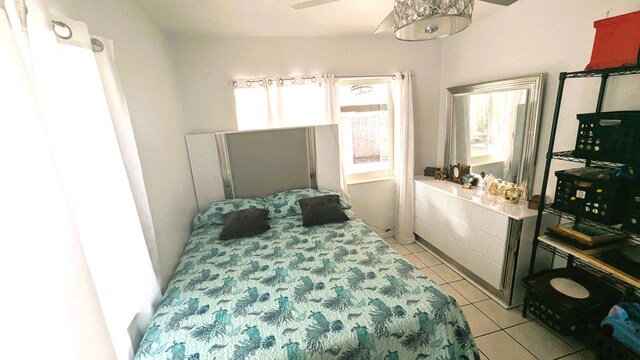 bedroom with light tile patterned floors and ceiling fan