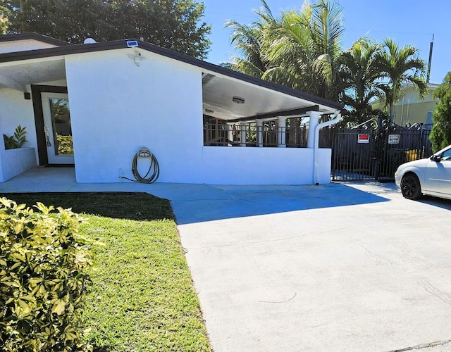 view of side of property with a carport