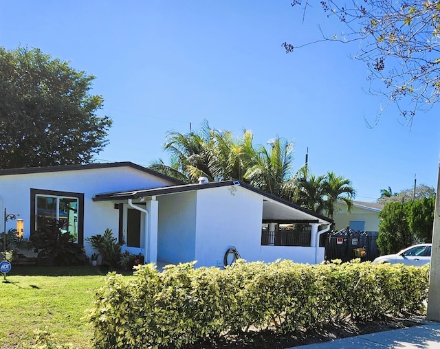 view of property exterior featuring a yard