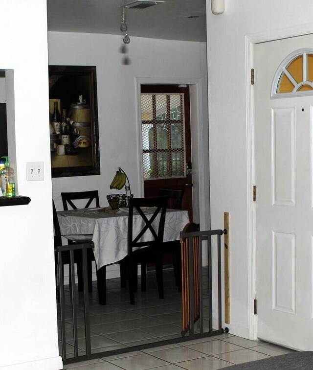 dining room with tile patterned floors