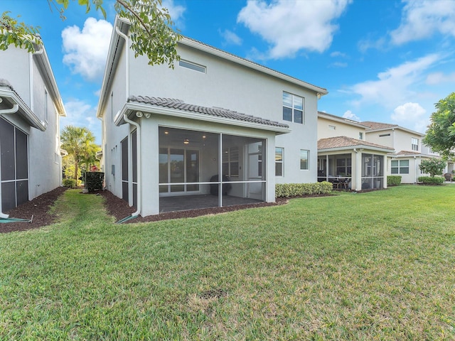 back of house with a lawn, central AC unit, and a sunroom