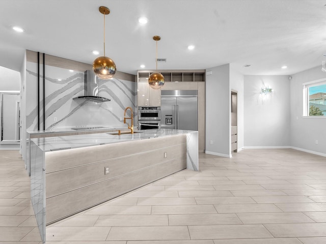 kitchen featuring backsplash, sink, hanging light fixtures, island range hood, and light stone counters