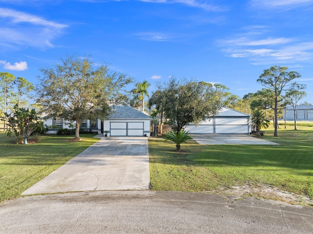 view of front of home featuring a front yard and a garage