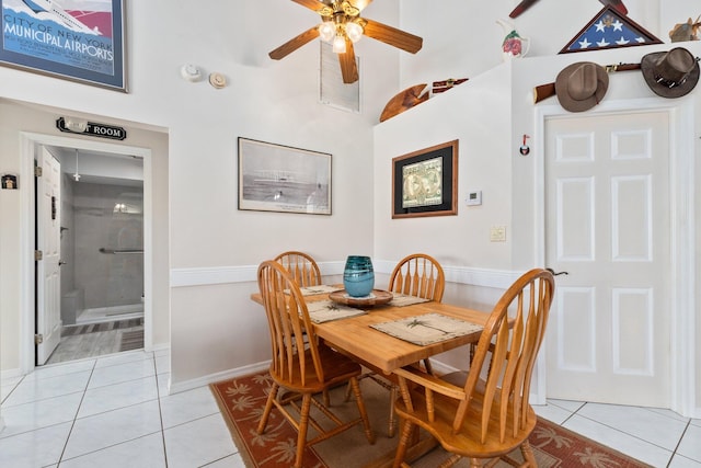 dining room with ceiling fan and light tile patterned flooring