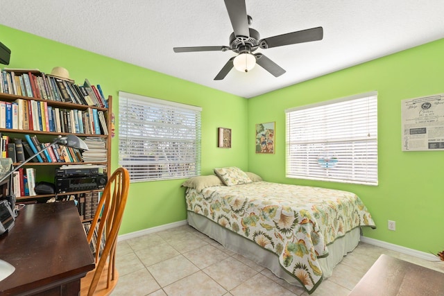 tiled bedroom with ceiling fan