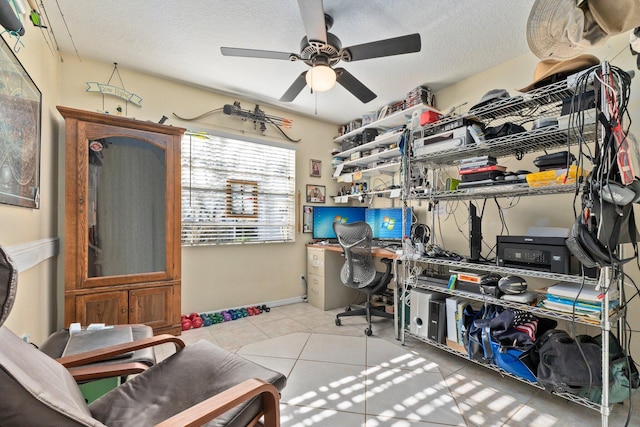 office space featuring ceiling fan, light tile patterned floors, and a textured ceiling