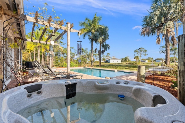 view of pool featuring a hot tub