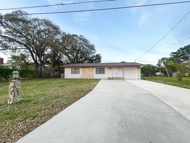 ranch-style home featuring a garage and a front yard