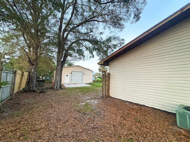 view of yard featuring an outbuilding and cooling unit