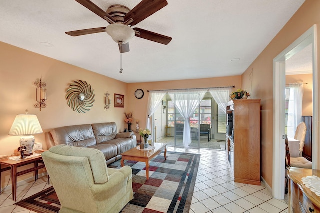 tiled living room featuring ceiling fan