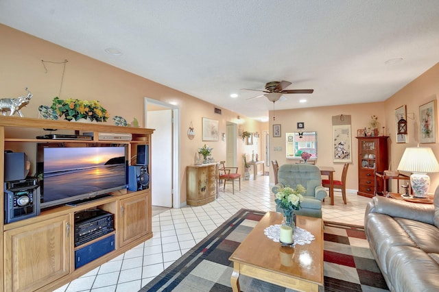 tiled living room featuring ceiling fan