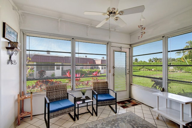 sunroom featuring ceiling fan and a healthy amount of sunlight