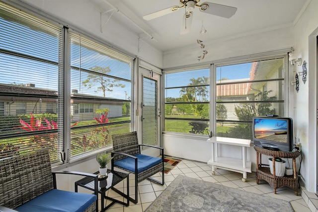 sunroom with ceiling fan and a wealth of natural light