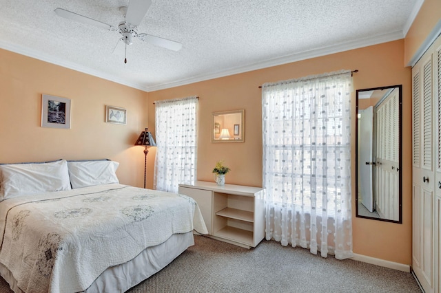 carpeted bedroom featuring a textured ceiling, ceiling fan, and crown molding