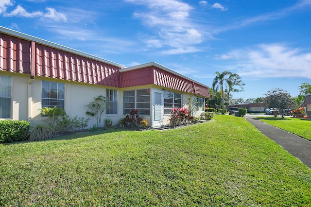 view of property exterior featuring a yard