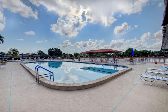 view of swimming pool with a patio area