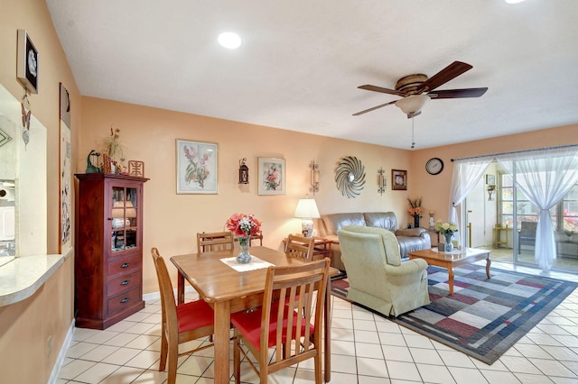 dining room featuring light tile patterned flooring and ceiling fan