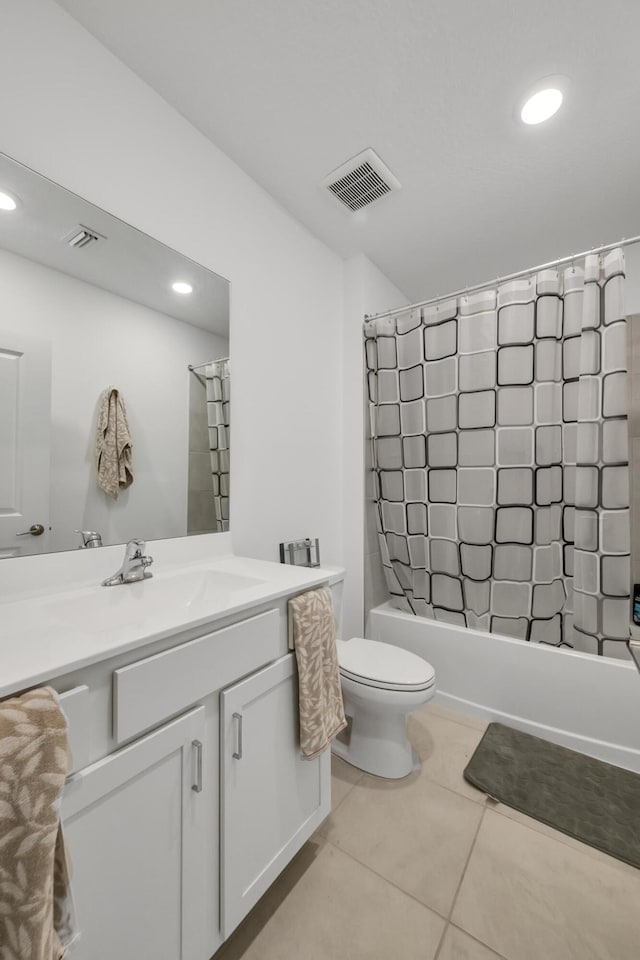 full bathroom featuring toilet, shower / bath combination with curtain, vanity, and tile patterned floors