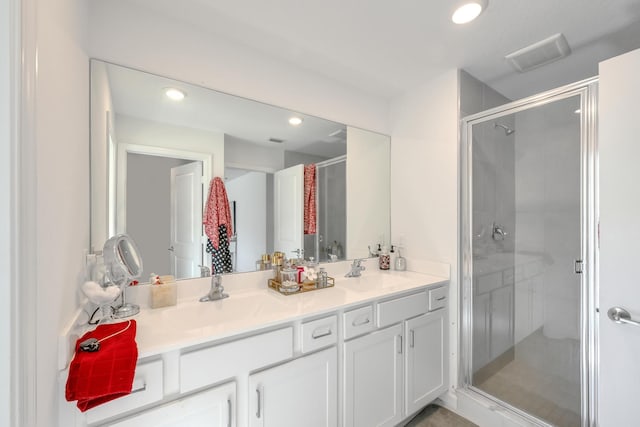 bathroom featuring vanity and walk in shower