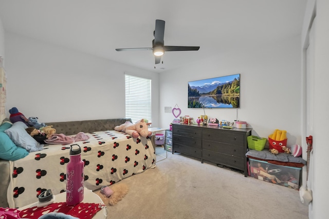 bedroom featuring ceiling fan and light carpet