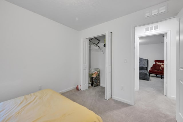 carpeted bedroom with a closet