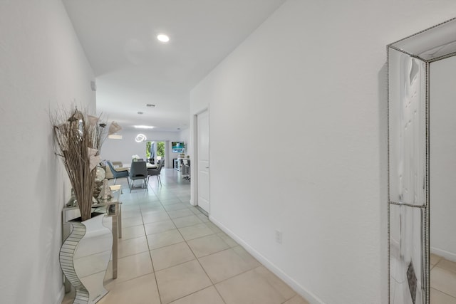 corridor with light tile patterned flooring