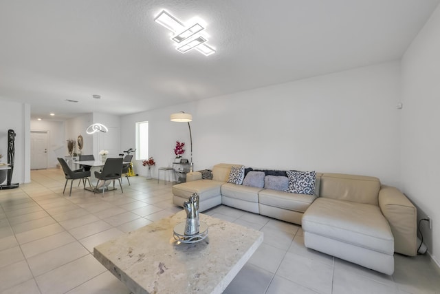 tiled living room with a textured ceiling