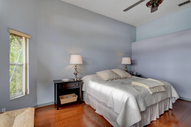 bedroom with wood-type flooring and ceiling fan