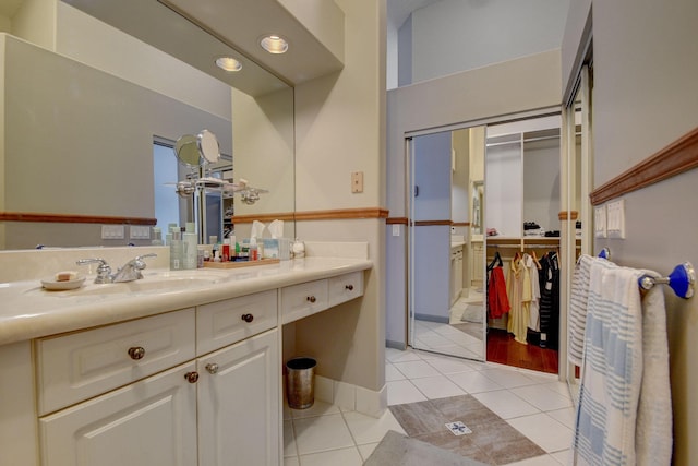 bathroom featuring tile patterned flooring and vanity