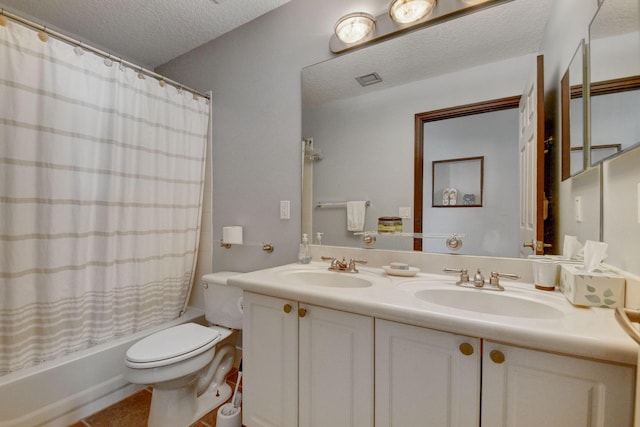 full bathroom with tile patterned floors, vanity, a textured ceiling, shower / bathtub combination with curtain, and toilet