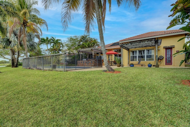 view of yard with a fenced in pool