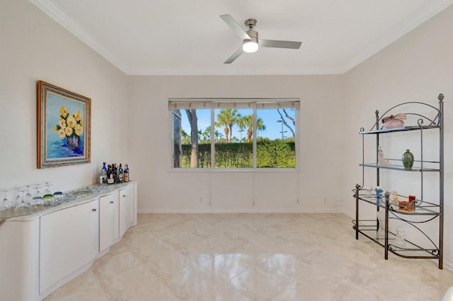 interior space with ceiling fan and ornamental molding