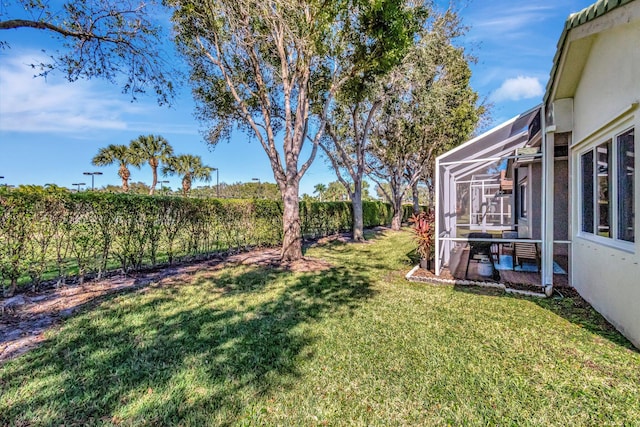 view of yard featuring a lanai