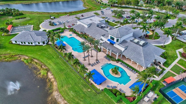 birds eye view of property with a water view