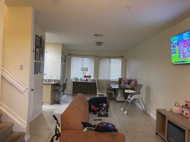 living room with light tile patterned floors