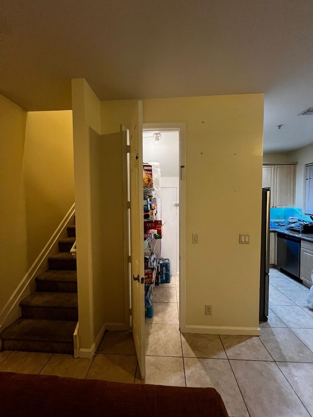 hallway with light tile patterned flooring