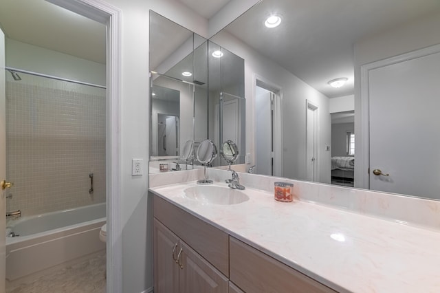 full bathroom with bathtub / shower combination, toilet, and vanity