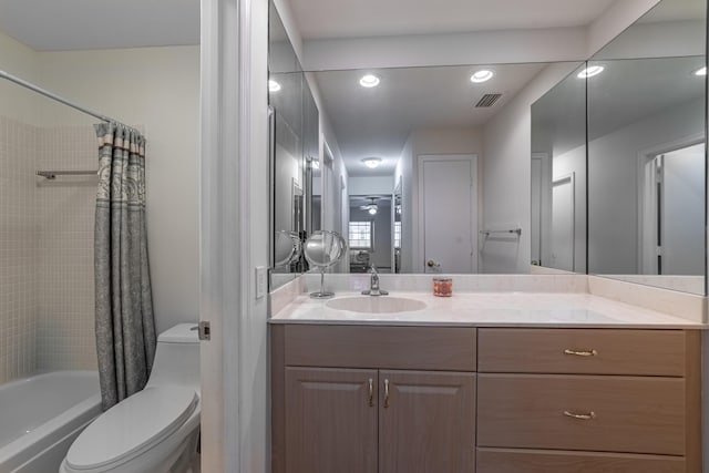 full bathroom with toilet, vanity, and shower / bath combo with shower curtain